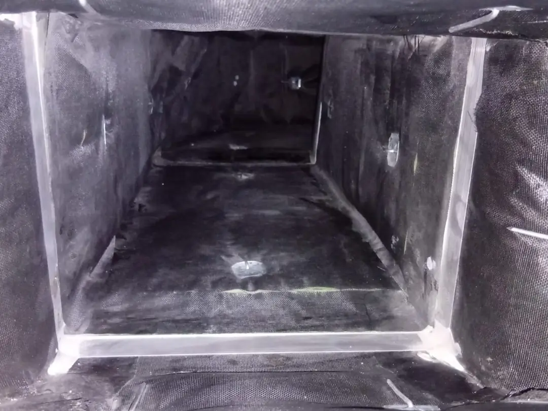 After cleaning: the same length of duct, lining brushed and vacuumed back to a clean, even surface.