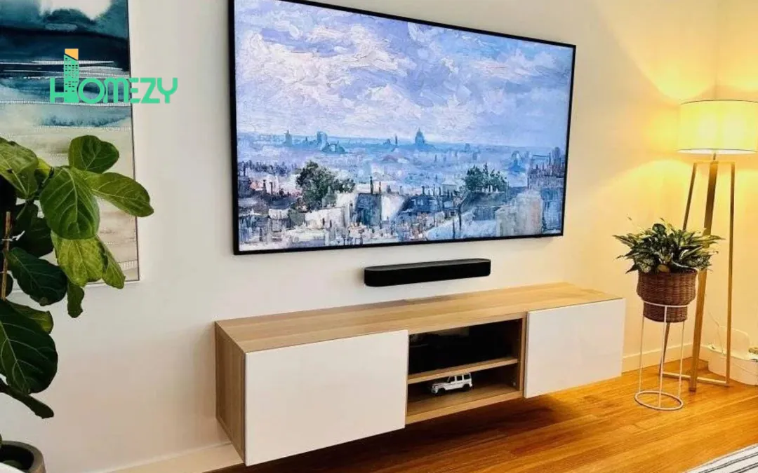 A television being fitted to a wall bracket during a professional TV mounting job in Dubai.